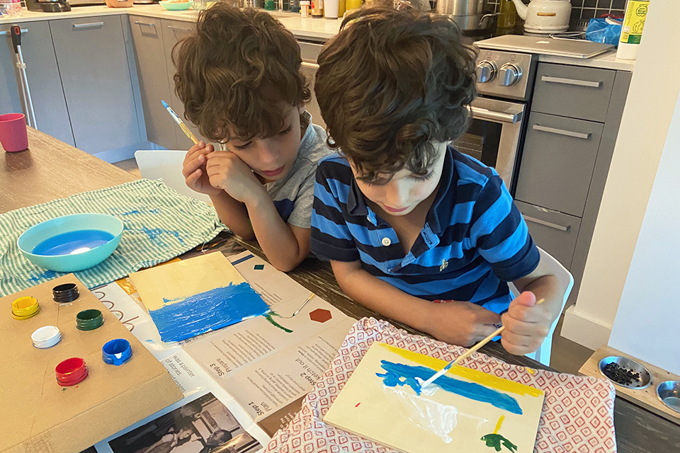 Kids can while away hours of a day with a set of watercolors and a stack of new paper for painting. Photo by Sara Marentette
